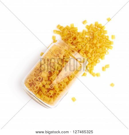Glass jar filled with dry ditalini yellow pasta over isolated white background