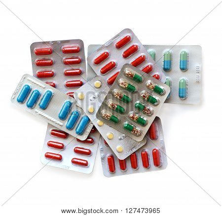 different multicoloured pills isolated on white background