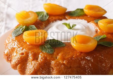 Savarin French Dessert With Apricots And Whipped Cream Macro. Horizontal