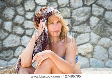 Portrait of beauty 50s woman on the beach