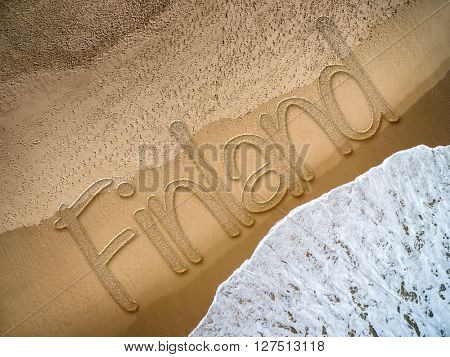 Finland written on the beach
