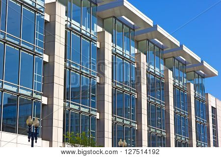 WASHINGTON DC, USA - APRIL 16: Architectural details of Convention Center building in Washington DC on April 16, 2016. Building windows illuminated by the light coming through roof openings.