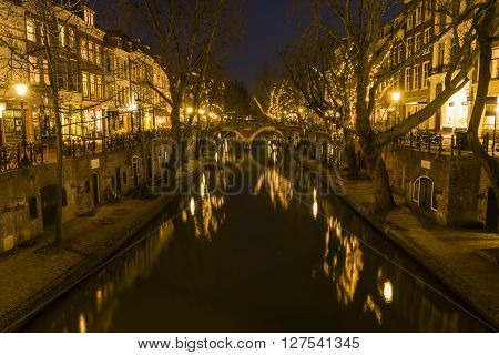 Utrecht, The Netherlands - March 14, 2015: Utrecht at night Oude Gracht bridge houses canal and restaurants.