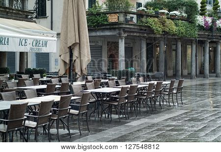 Lecco, Italy - September 2nd 2015: a wine bar and pizza restaurant photographed in Lecco Italy on a rainy morning.