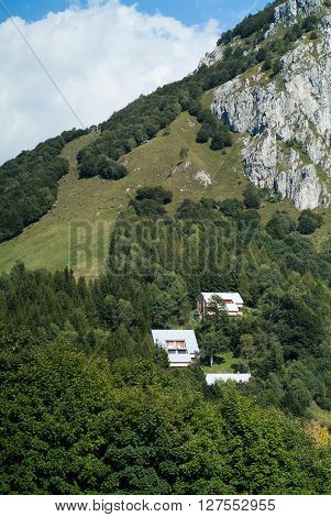three houses photographed at Piani d'Erna (part of the Alps) near Lake Como in Italy