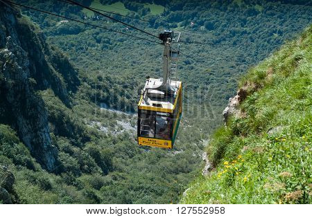 Piani d'Erna Italy - September 7th 2015: a yellow cable car carrying passengers down from Piani d'Erna (part of the Italian Alps)