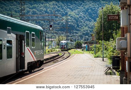 Colico Italy - September 8th 2015: a Trenord train approaching a platform in Colico a town in the northern part of Lake Como