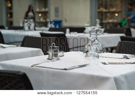Lecco Italy - September 8th 2015: wine glasses beautifully arranged on a white table at a restaurant in Lecco an Italian town near Lake Como.