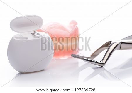 Teeth Model With Dental Floss On White Background