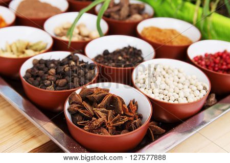 Spices and herbs in metal  bowls. Food and cuisine ingredients. Colorful natural additives.
** Note: Shallow depth of field