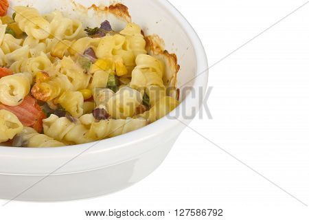 Pasta with cheese gratain in an oval dish isolated on white background  focus stacking.