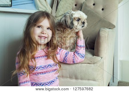 happy girl with her dog at home