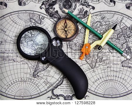 A set of tools for travel on the background of the world map.