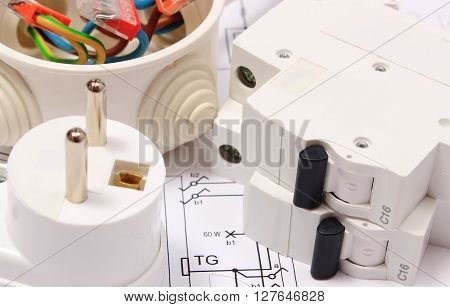Electric fuse and plug copper wire connections in electrical box on construction drawing of house accessories for engineering work energy concept