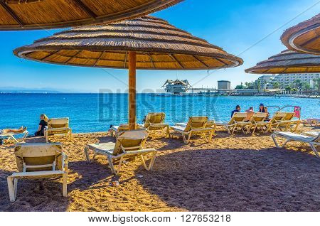 EILAT ISRAEL - FEBRUARY 23 2016: Winters in Eilat are very soft and comfortable for relaxing on the beach on February 23 in Eilat.