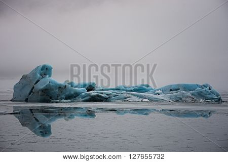 Beautiful light-blue iceberg in glacier lake Jökulsárlón in Iceland