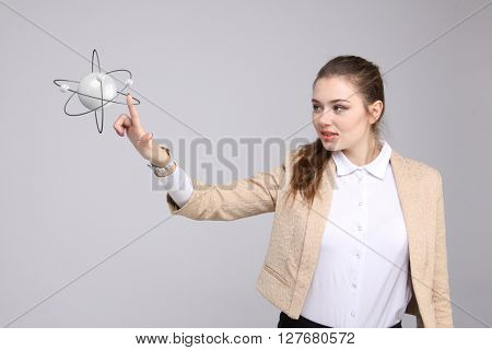 Woman scientist with atom model, research concept