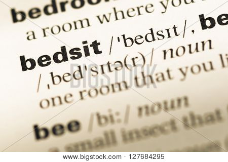 Close Up Of Old English Dictionary Page With Word Bedsit.
