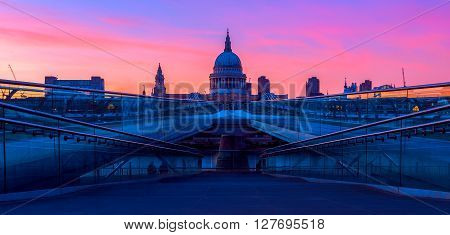 Panoramic view of purple sunset at St Paul's Cathedral and the Millennium Bridge in London