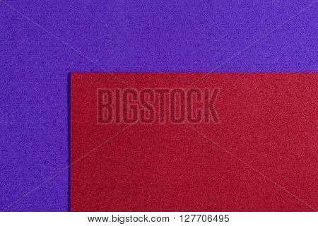Eva foam ethylene vinyl acetate red surface on purple sponge plush background