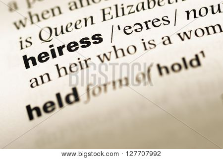 Close Up Of Old English Dictionary Page With Word Heiress.
