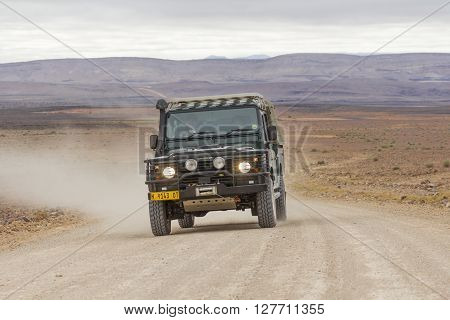 FISH RIVER CANYON NAMIBIA - SEPTEMBER 01 2015: SUV in the C12 scenic dirt road in the desert leading to the Fish River Canyon Namibia