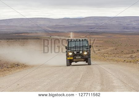 FISH RIVER CANYON NAMIBIA - SEPTEMBER 01 2015: SUV in the C12 scenic dirt road in the desert leading to the Fish River Canyon Namibia