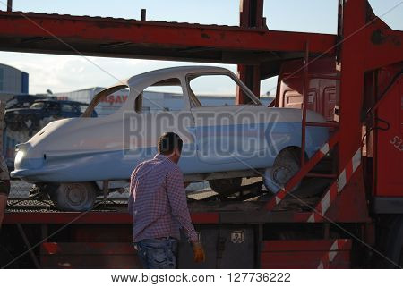 ANKARA/TURKEY-APRIL 28,2016: Tricar on the towing trailer at the Sasmaz Auto Industry Site. April 28, 2016-Ankara/Turkey