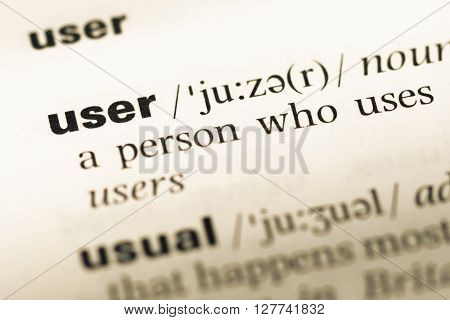 Close Up Of Old English Dictionary Page With Word User.