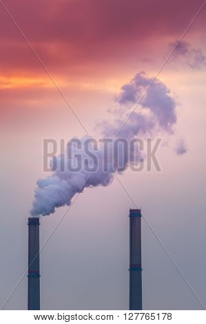 Industrial cityscape with coal power plant and smoke stacks