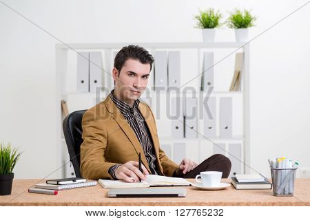 Thoughtful Man At Office Desk
