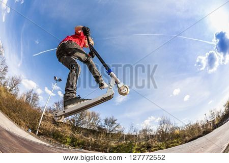 Boy Jumping With A Scooter