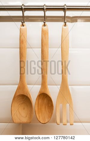 Wood ladles hanging on wall kitchen concept.