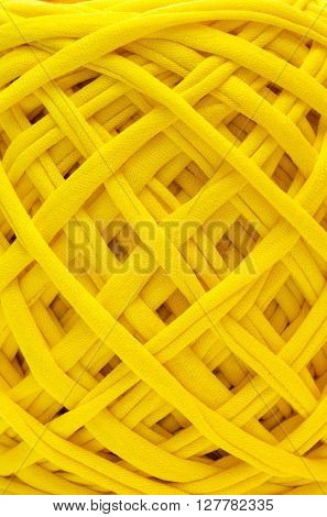 Texture of thick  yellow knitting yarns close-up