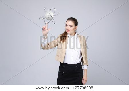 Woman scientist with atom model, research concept