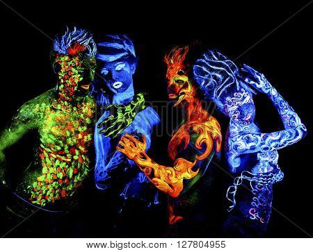 Four elements. Body art glowing in ultraviolet light, isolated on black background