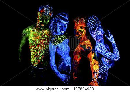 Four elements. Body art glowing in ultraviolet light, isolated on black background