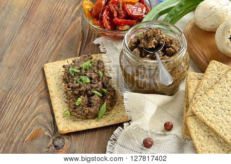 Mushroom pate and dried tomatoes with crackers mousse