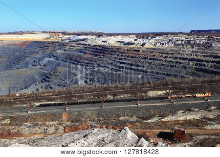 rising from the pit train with  beard against the backdrop of the city of Gubkin away