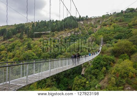 Khndzoresk, Armenia - September 10, 2014:  Khndzoresk Swinging Bridge. Suspension bridge over the gorge near Goris village.