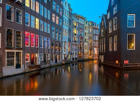 Houses over canal with reflections at night, Amstardam, Netherlands