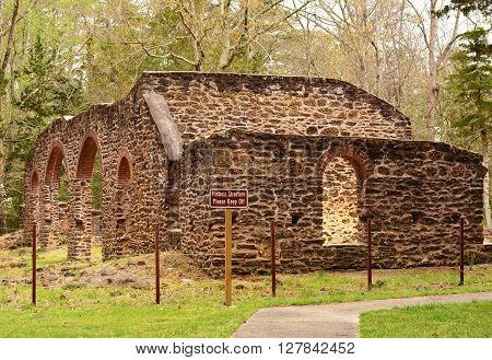 Estelle Manor, New Jersey-USA  April 30, 2016  An old Glass factory building made of stone that is still standing.