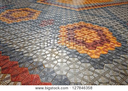Colored interlock paving set out in geometric patterns