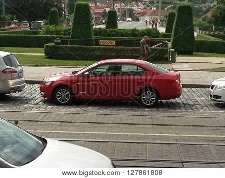 PRAGUE CZECH REPUBLIC - CIRCA JUNE 2015: red Skoda Octavia in a street of the city centre