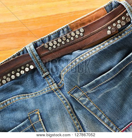 blue jeans with brown leather belt, clothing design