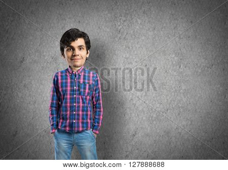 Funny young bigheaded man in casual with hands in pockets