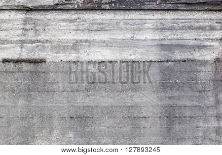 Old grunge concrete wall background texture with drainage holes and moisture stains with discoloration full frame view