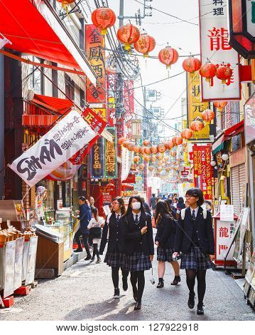 YOKOHAMA JAPAN - NOVEMBER 24 2015: Yokohama Chinatown is Japan's largest chinatown. A large number of Chinese stores and restaurants can be found in the narrow and colorful streets