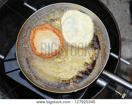 Sweet Pastry Frying In Hot Oil