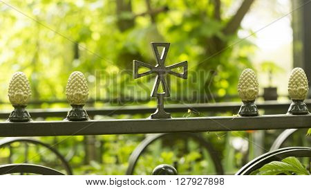 Decorative ornament made of old metal on the fence